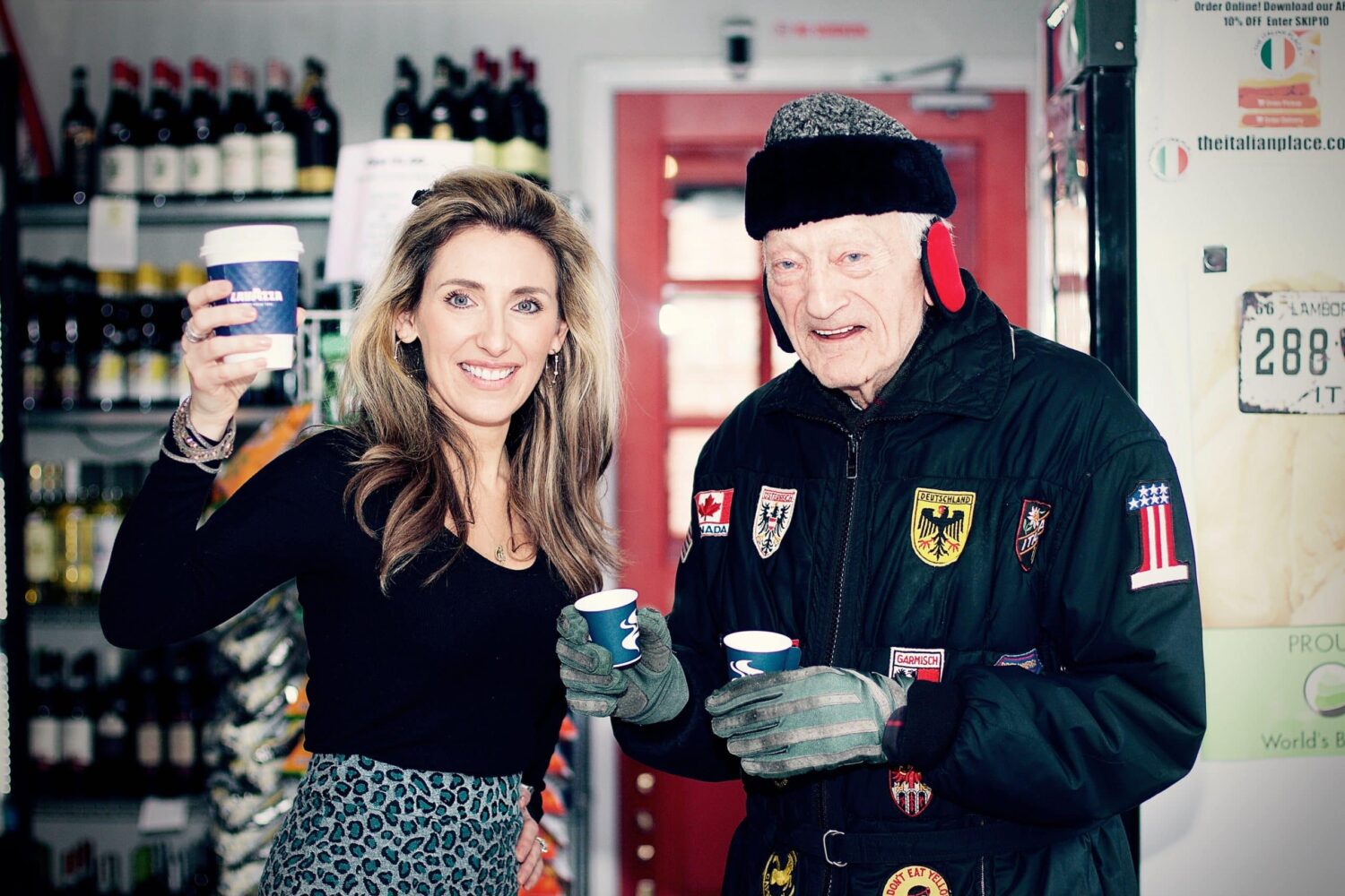 Two people toasting coffee