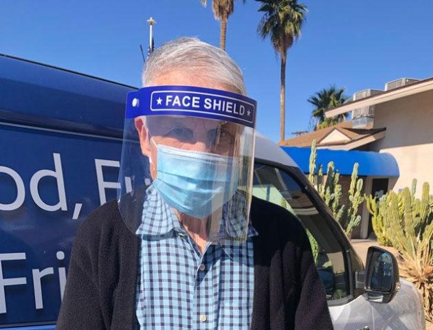 Senior Care A man wears a face mask and shield for COVID-19 protection