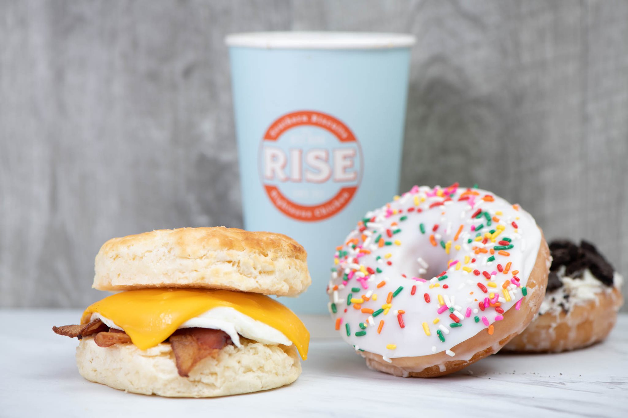 Rise Southern Biscuits breakfast franchise sandwich, coffee and donut.