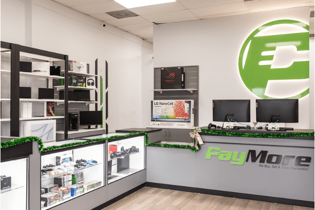 Showing inside a PayMore store and shelves of electronics