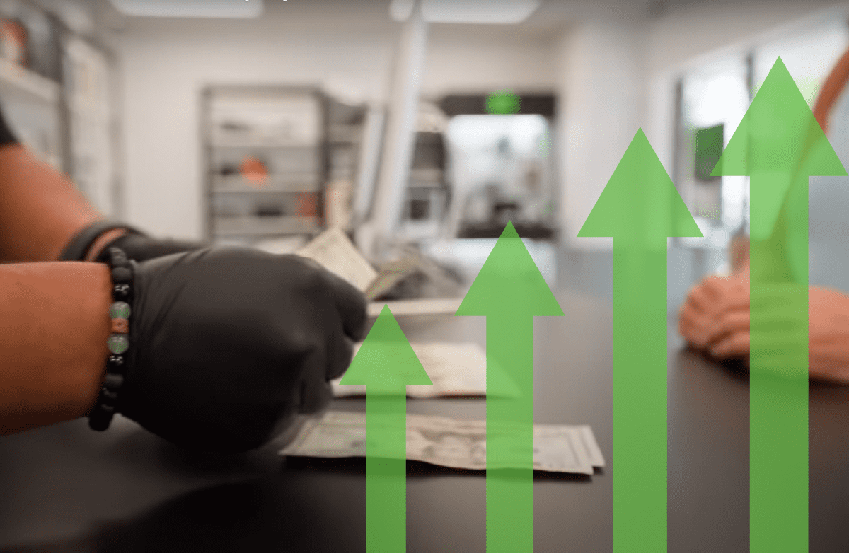PM growth 1200×782 (1) Photo of paymore employee counting cash with growth sign