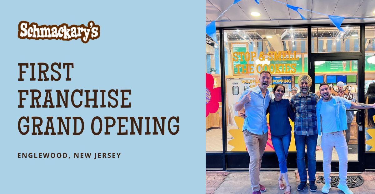 graphic that says Schamckary's first franchise grand opening in englewood new jersey with a photo to the right of Schmackary's leadership with the franchisees