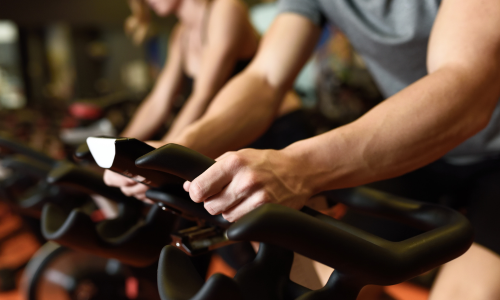 People riding cycle bikes at a fitness class