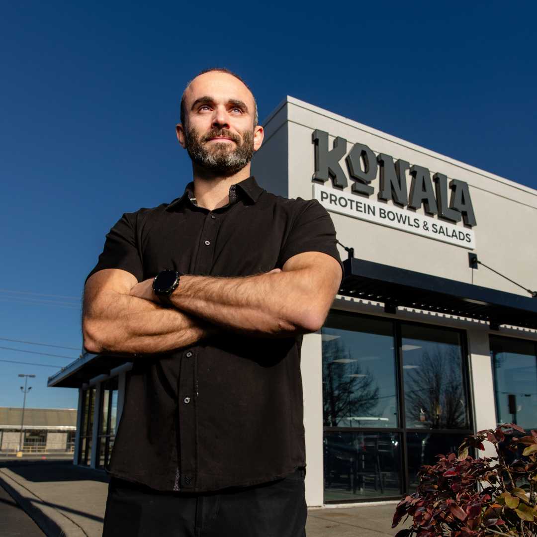 Trace Miller standing in front of Spokane location