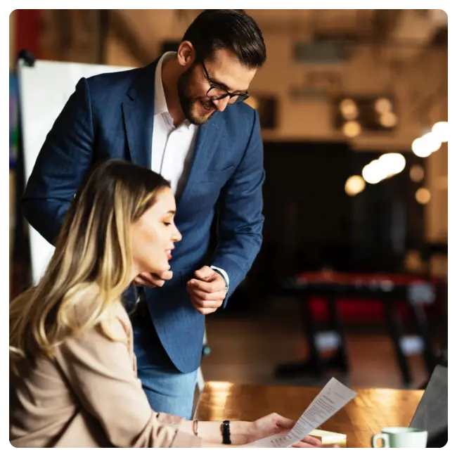 Woman and man reviewing financial investment