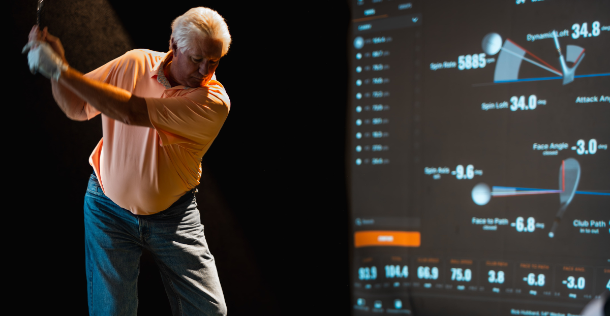 Man hitting indoor golf ball on trackman
